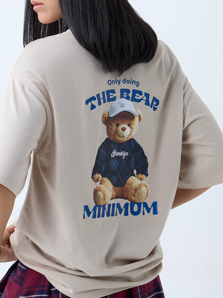 Beige Oversized Graphic T-Shirt for Women – “The Real Minimum” Teddy Print - Image 3