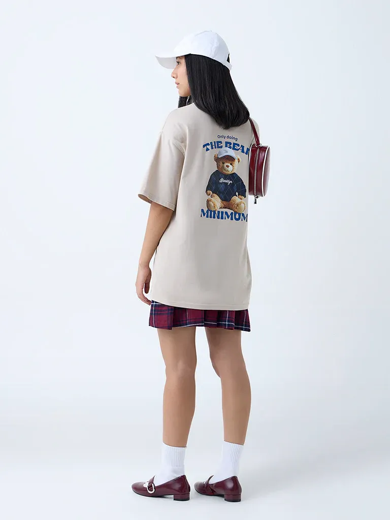 Beige Oversized Graphic T-Shirt for Women – “The Real Minimum” Teddy Print - Image 2